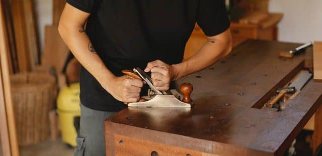 A carpenter working on a table
